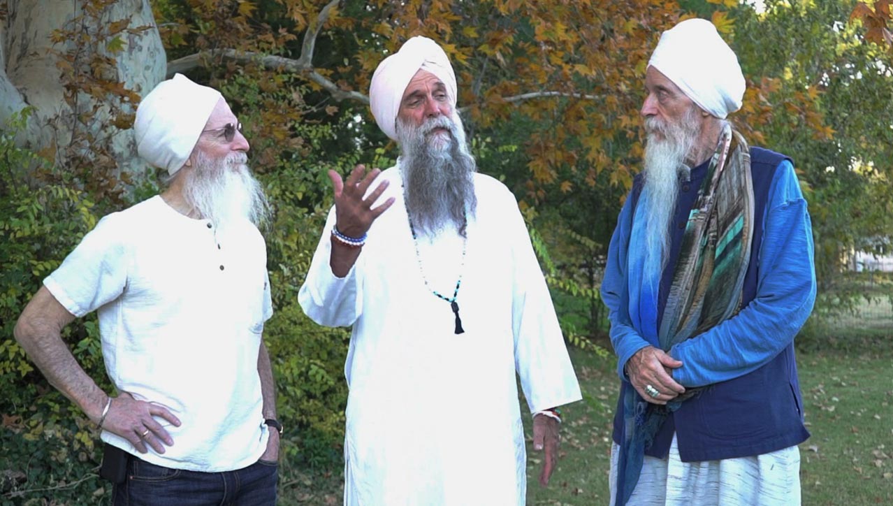 Three happy gurus in conversation